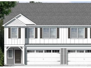 New construction home with vertical siding, a gray roof, brown shutters, and a two-car garage at 3926 Litchfield Rd, Charlotte, NC 28211