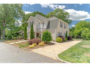 Charming two-story home with a well-manicured lawn and beautiful landscaping, offering great curb appeal at 420 S Cedar St, Lincolnton, NC 28092