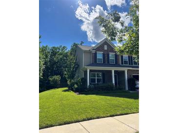 Charming two-story home boasts a well-manicured lawn and inviting front porch at 7930 Kelburn Ln, Charlotte, NC 28273