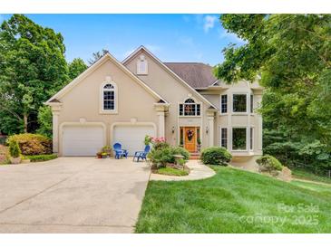 Inviting exterior with a two-car garage and a well-manicured lawn and attractive architectural elements at 133 37Th Avenue Nw Pl, Hickory, NC 28601
