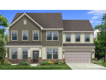 Charming two-story home with a mix of vertical and horizontal siding and a well-manicured front lawn at 859 Regulus Ct, York, SC 29745