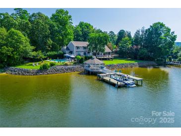 Expansive lakeside home featuring a private dock, gazebo, and stunning water views at 15 Old Stage Trl, Clover, SC 29710