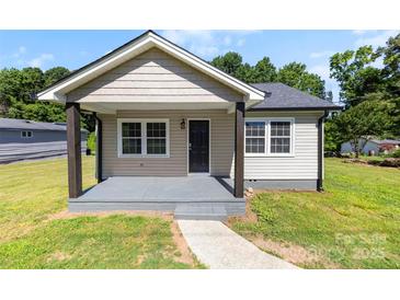 Charming single-story home with a covered front porch, neutral siding and walkway at 2009 Auten Rd, Gastonia, NC 28054
