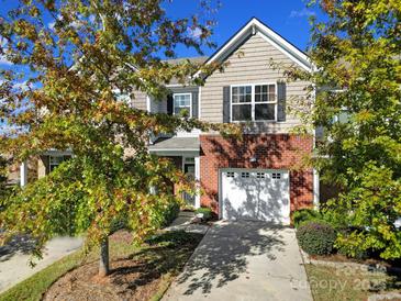 Charming two-story home with brick and siding, complemented by a one-car garage and well-maintained landscaping at 3342 Yarmouth Ln, Gastonia, NC 28056