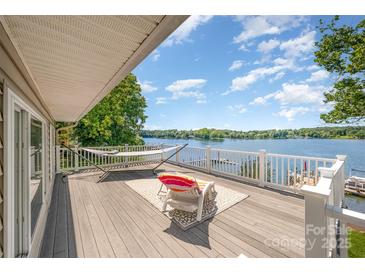 Lake views abound from this deck with outdoor seating, hammock and white railing overlooking the water at 4586 Doctor Dr, Catawba, NC 28609