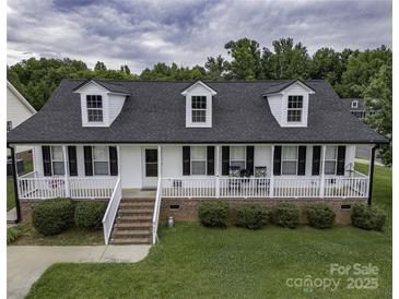 Charming home with a welcoming front porch, dormer windows, and manicured lawn at 532 Jedburgh Way, Rock Hill, SC 29730