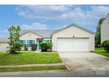 Charming single-story home with attached garage, vibrant turquoise shutters, and well-maintained lawn at 9623 Duxford Ln, Charlotte, NC 28269