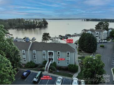 Waterfront condo boasts deeded boat slip, assigned parking, and gorgeous water views at 20417 Harborgate Ct # 510, Cornelius, NC 28031
