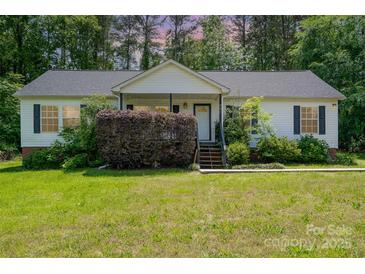 Charming single-story home with a well-maintained lawn and a quaint front porch entry at 321 Woodcrest Dr, York, SC 29745