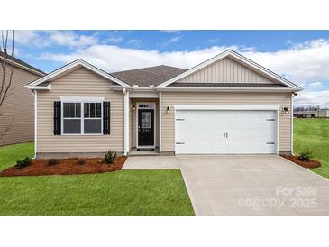 Charming single-story home with manicured lawn, neutral siding, and attached two-car garage at 4607 Harris Elliot Rd, Lincolnton, NC 28092