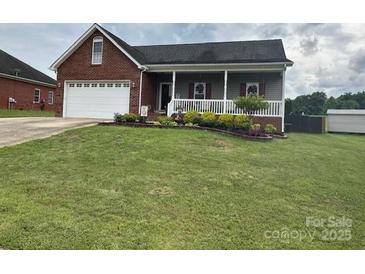 Charming single-story home with a well-maintained lawn and a welcoming front porch at 111 Brookview Dr, Shelby, NC 28152