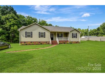 Charming single-story home with a well-manicured lawn and inviting front porch at 3125 Leonard Dr, Gastonia, NC 28056