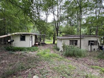 Rustic home exterior with two small cabins nestled within a wooded area at 509 Waring Ct # Lot 4, Fort Mill, SC 29707