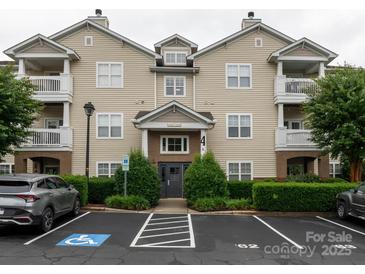 Inviting exterior of the home featuring manicured landscaping and ample parking spaces at 17119 Doe Valley Ct, Cornelius, NC 28031