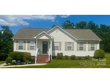 Charming single-story home with a well-manicured lawn and inviting front porch at 1743 Silver Stream Dr, Rock Hill, SC 29730
