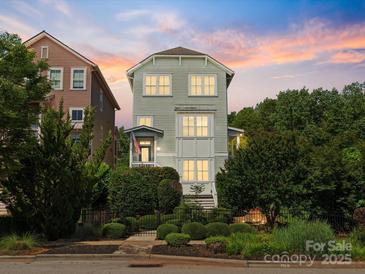 Charming three-story home with professional landscaping, fenced yard and inviting curb appeal at 807 Herrons Ferry Rd, Rock Hill, SC 29730