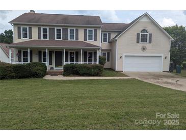 Charming two-story home with a covered front porch and manicured lawn at 936 New Camp Creek Church Rd # 11, Kings Mountain, NC 28086