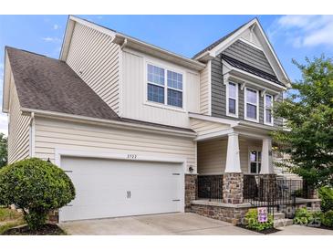 Charming two-story home showcasing stone accents, neutral siding, and an attached two-car garage at 2522 Richland Balsam Dr # 450, Fort Mill, SC 29715