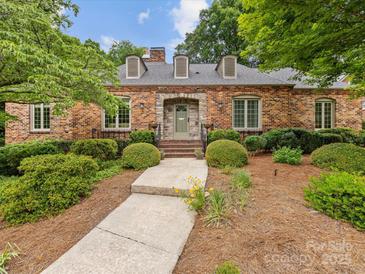 Charming brick home with well-manicured landscaping and a welcoming front entrance at 3225 Mill Pond Rd, Charlotte, NC 28226