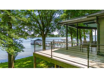 Stunning lake view from the deck, featuring modern railings and ample seating space at 3248 Lake Shore S Rd, Denver, NC 28037
