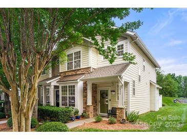 Charming two-story home with well-maintained landscaping and inviting front porch at 424 River Park Rd, Belmont, NC 28012