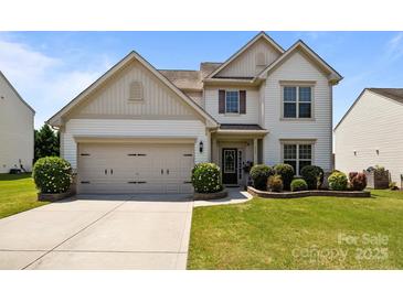Charming two-story home with landscaped yard and an attached two-car garage at 1035 Ivey Ct, Indian Land, SC 29707