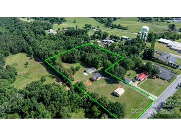 Expansive aerial view shows a large parcel of land surrounded by lush trees and greenery at 3423 S Hwy 127 Hwy, Hickory, NC 28602