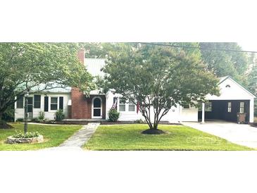 Charming single-story home with well-maintained landscaping and a welcoming front entrance at 423 N Cedar St, Lincolnton, NC 28092