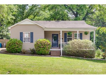 Charming single-story home with a cozy front porch and well-maintained landscaping at 203 Lincoln St, Belmont, NC 28012