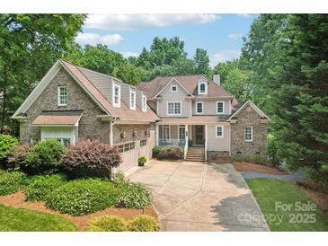 Charming two-story home with a well-manicured lawn and brick accents at 3327 Lakeside Dr, Charlotte, NC 28270