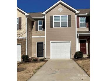 Charming townhome featuring attached garage, and neutral color scheme at 9170 Bradstreet Commons Way, Charlotte, NC 28215