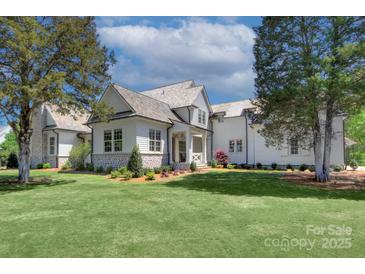 Charming exterior with manicured lawn, stylish stone accents, and a welcoming front porch at 2270 New Gray Rock Rd, Fort Mill, SC 29708