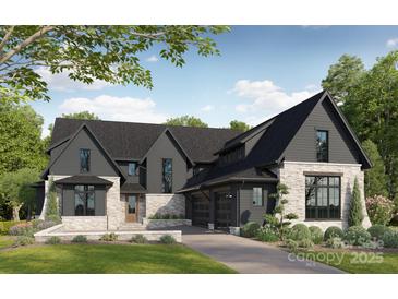 Stunning two-story home featuring a stone and board and batten facade and three-car garage at 20000 Schooner Dr, Cornelius, NC 28031