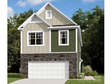 Charming two-story home with stone accents and attached two car garage at 3411 Secrest Lndg, Monroe, NC 28110