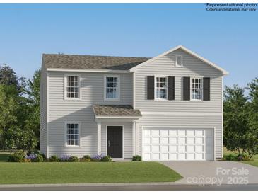 Charming two-story home featuring a two-car garage and classic architectural details at 6337 Fairfax Ct, Maiden, NC 28650
