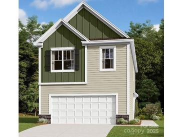Charming two-story home features a convenient one-car garage and a mix of vertical and horizontal siding at 750 Kitfox Nw Dr, Concord, NC 28027