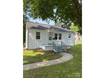 Charming painted brick home featuring a walkway and a cozy covered front porch at 317 Heilig Ave, Salisbury, NC 28144