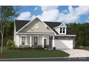 Charming home featuring stone accents, a covered porch, and a well-manicured lawn at 951 Exeter Dr, Sherrills Ford, NC 28673