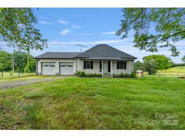 Charming single-story home featuring an attached two-car garage and a covered front porch at 956 Stony Point Rd, Kings Mountain, NC 28086