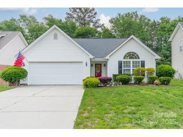 Charming single-Gathering home featuring a well-manicured lawn, two-car garage, and inviting curb appeal at 199 Ashmont Dr, Kannapolis, NC 28081
