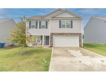 Charming two-story home with vinyl siding, stone accents, and a two-car garage at 2859 Sherrills Stream Dr, Sherrills Ford, NC 28673