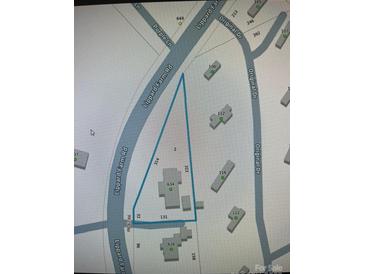 A map of the property with parcel lines shown on a corner lot near the intersection of two neighborhood streets at 634 Lippard Farm Rd, Statesville, NC 28625