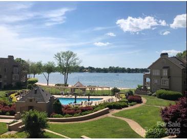 Beautiful pool view with beach access and gazebo near the lake at 635 Portside Dr, Davidson, NC 28036