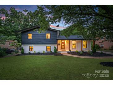 Charming two-story home with a beautifully landscaped yard and inviting exterior at 3326 Winterfield Pl, Charlotte, NC 28205