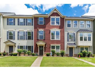 Charming townhouse with well-manicured lawn, lush landscaping and inviting curb appeal at 4060 Zilker Park Dr, Charlotte, NC 28217