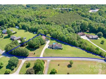 Aerial view of home on large lot outlined in blue at 136 Barringer Dr, Statesville, NC 28625