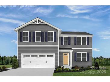 Charming two-story home featuring gray siding, a white garage door, and a well-maintained front yard at 12109 Beaux Art Ln, Charlotte, NC 28214