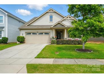 Charming one-story home with attached garage and well-maintained lawn, offering great curb appeal at 16213 Kelby Cv, Charlotte, NC 28278