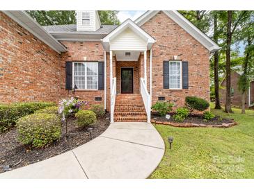 Charming brick home with a covered front porch and well-manicured landscaping at 212 Victoria Cir, York, SC 29745