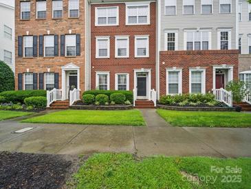 Charming brick townhomes with well-maintained landscaping and inviting entrances at 9564 Kings Parade Blvd, Charlotte, NC 28273
